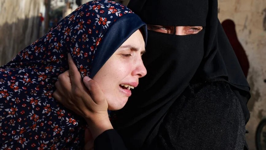 The mother of twin babies killed in an overnight Israeli air strike mourns their death in the southern Gaza Strip on 3 March 2024 (Mohammed Abed/AFP)