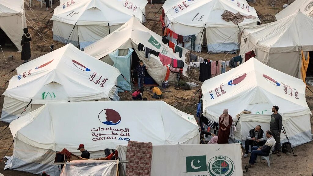 The tents of Palestinians displaced by Israel’s bombardment are pictured in Rafah, in the southern Gaza Strip, on 18 December 2023 (Mahmud Hams/AFP)