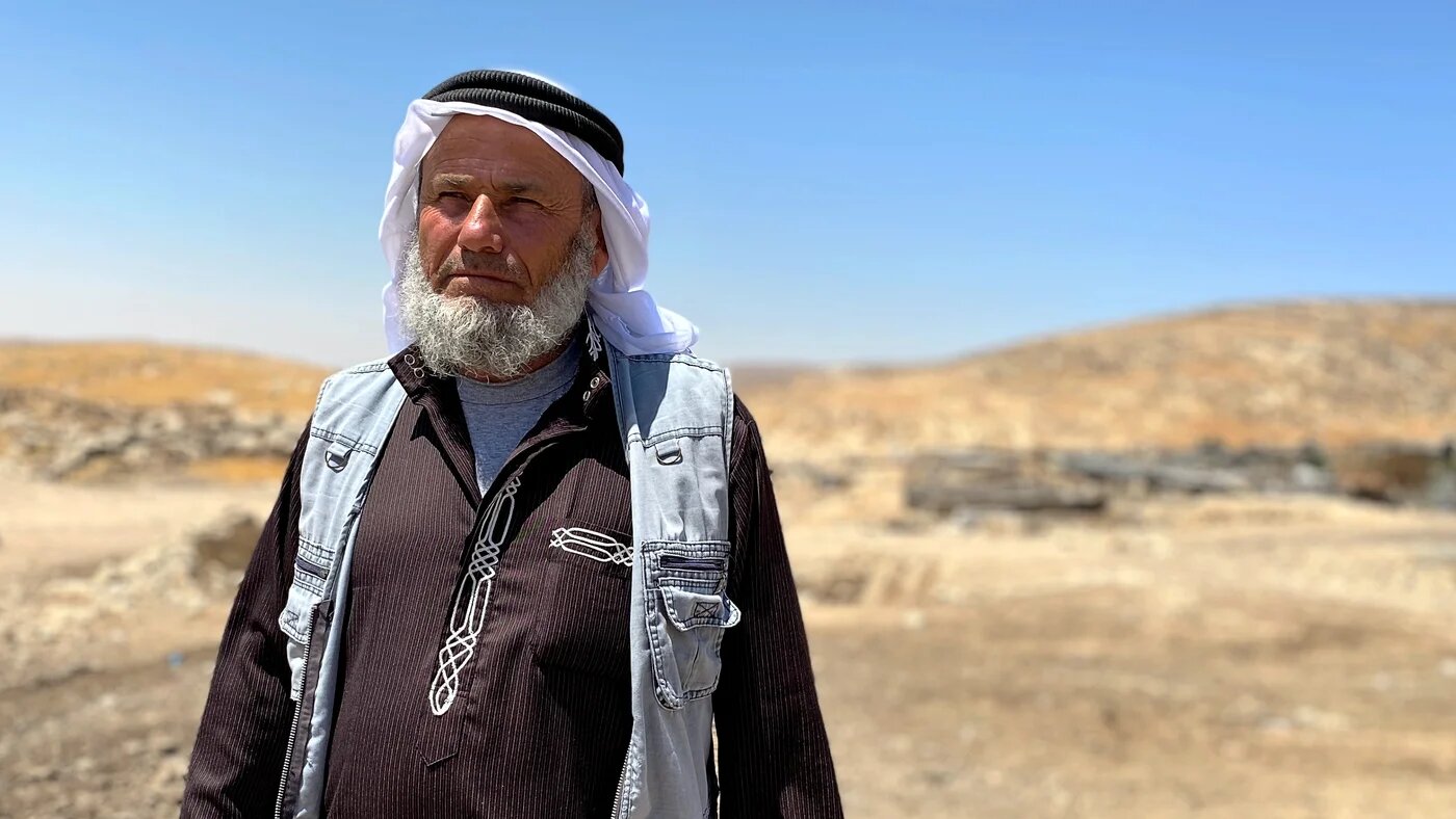 Ali Jabarin stands in Janba village in Masafer Yatta, a community of 2,500 Palestinians facing imminent expulsion by the Israeli army, on 19 June 2022. (MEE/Shatha Hammad)