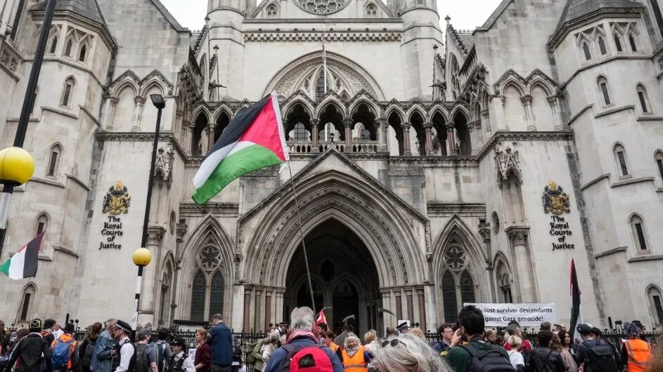 Pro-Palestine march outside the Royal Courts of Justice to oppose the proscription of Palestine Action on 15 June 2026 (AFP)