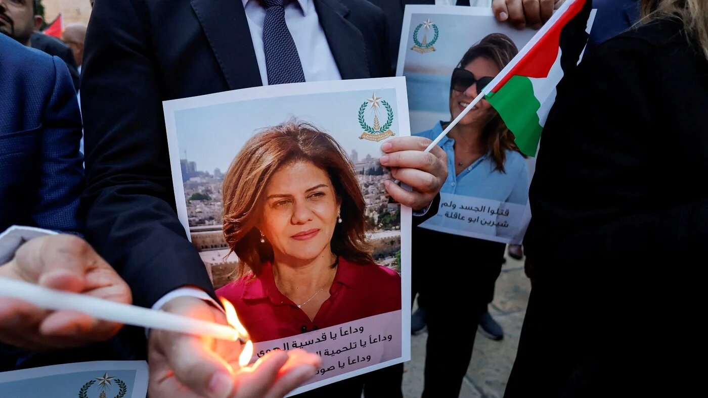 People in the occupied West Bank city of Bethlehem light candles during a vigil in memory of Al Jazeera journalist Shireen Abu Akleh, on 16 May 2022.