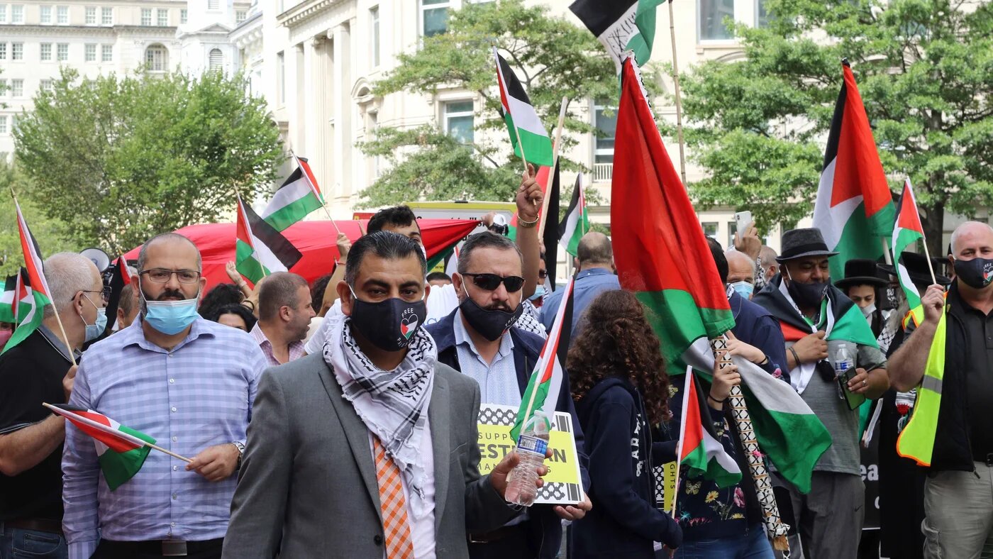 The protesters marched on the streets just outside the White House, waving Palestinian flags and chanting 'Free Palestine'.