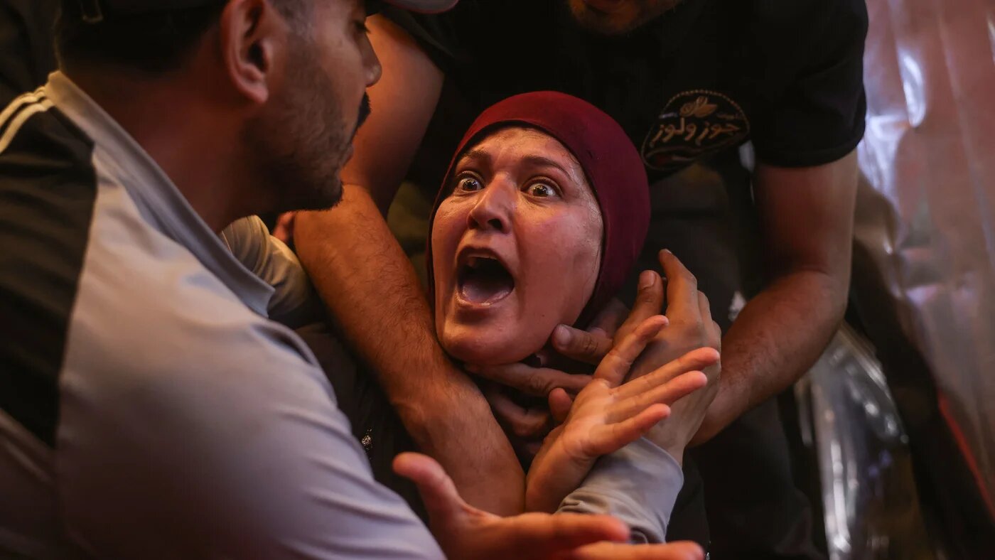 A Palestinian woman mourns victims of an Israeli air strike on a police station, in Khan Younis, south Gaza, on 7 June, 2026 (Bashar Taleb/AFP)