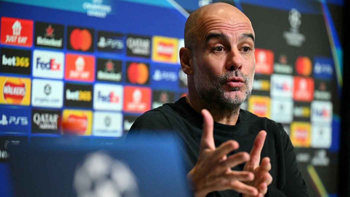 Manchester City's Spanish manager Pep Guardiola speaks during a press conference at the Etihad Campus training ground in Manchester, north-west England, on 27 January 2026 (AFP/Oli Scarff)