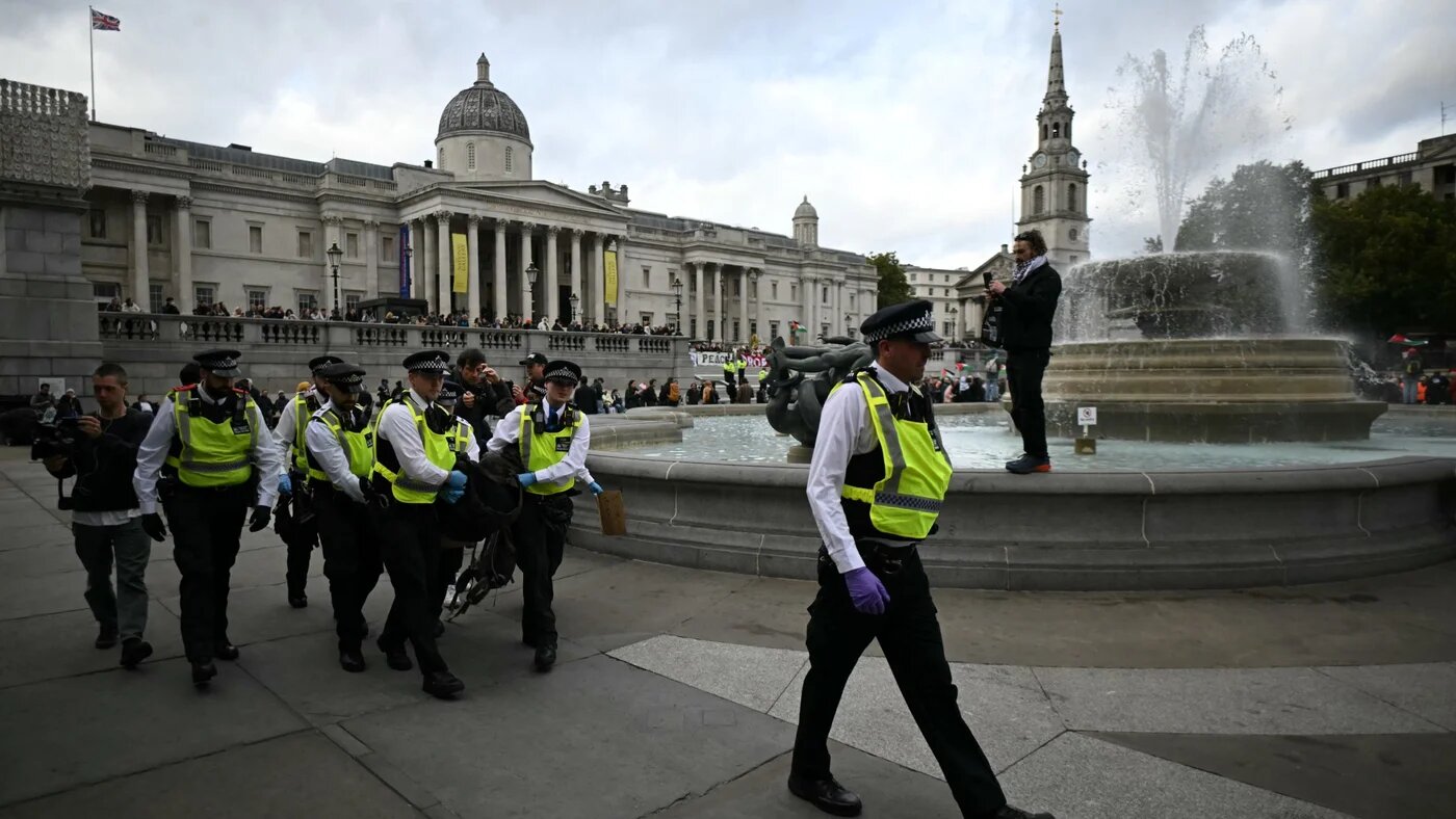 Police officers detain a protester during a Lift The Ban demonstration in support of the proscribed group Palestine Action in London on 4 October 2025 (Justin Tallis/AFP)