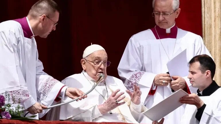 Pope Francis appears on the balcony of St Peter's Basilica on Easter Sunday (Reuters)