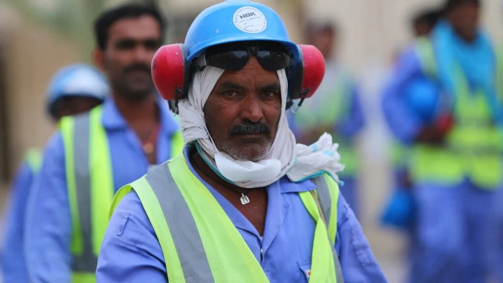 Foreign labourers working on a World Cup football stadium are pictured in Doha in May 2015 (AFP)