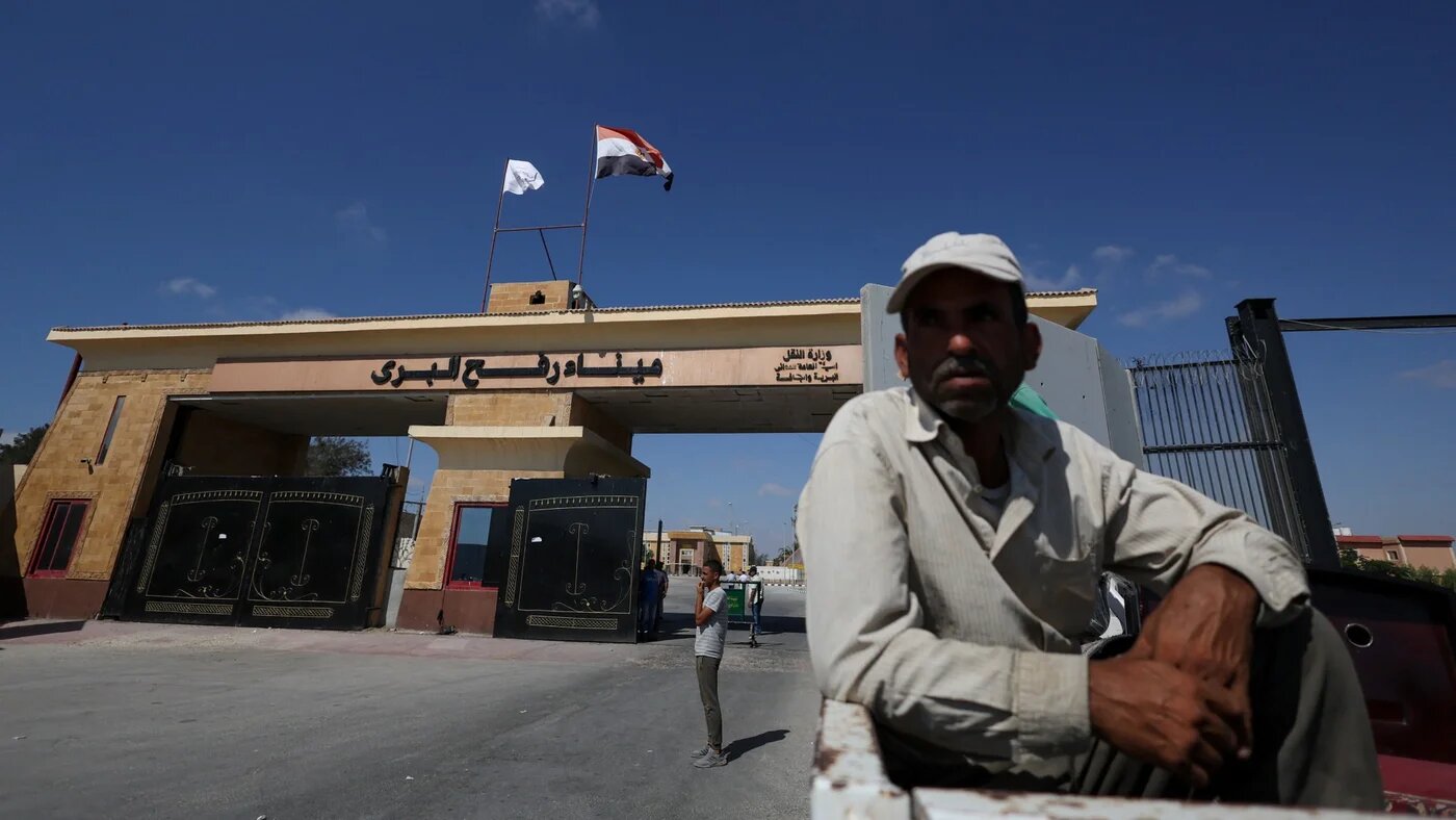 Ambulances wait on the Egyptian side of the Rafah border crossing with the Gaza Strip in north-eastern Egypt on 1 February 2026 (AFP)