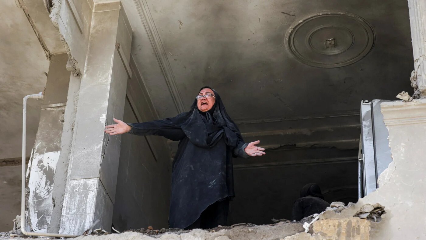 A woman reacts inside her brother's home, which was damaged by a strike, as the U.S.-Israeli conflict with Iran continues, in Tehran, Iran, March 30, 2026. Majid Asgaripour/WANA (West Asia News Agency) via REUTERS ATTENTION EDITORS - THIS PICTURE WAS PROVIDED BY A THIRD PARTY TPX IMAGES OF THE DAY