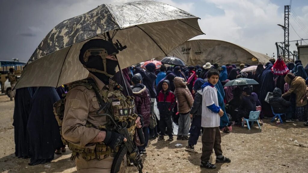 Members of Syria's Kurdish Internal Security Police Force, also known as Asayesh, and the Kurdish-led Syrian Democratic Forces (SDF) stand guard at al-Roj camp in Syria's northeastern Hasakah province on 5 April, 2025. (AFP)