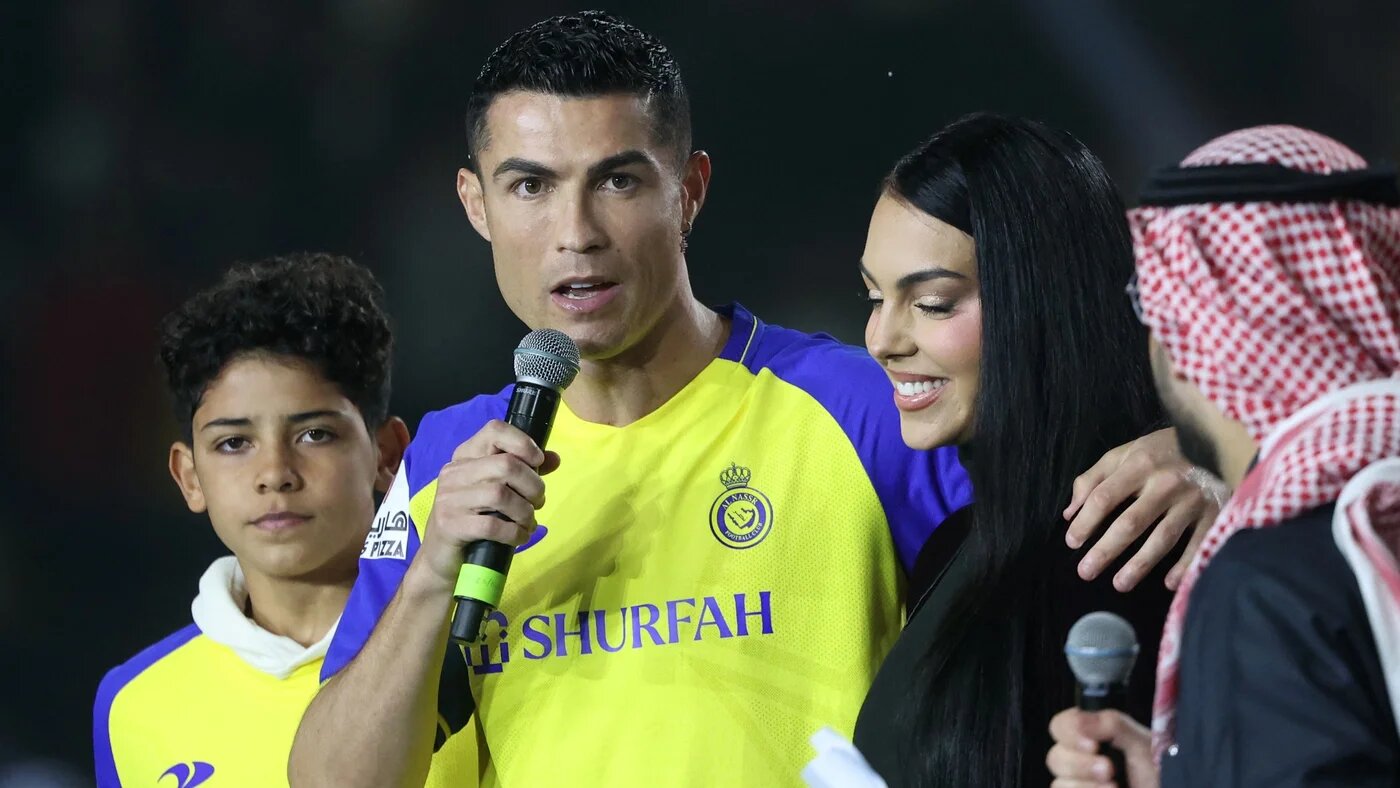 Portuguese forward Cristiano Ronaldo accompanied by his partner Georgina Rodriguez and his son Cristiano Ronaldo Jr at the Mrsool Park Stadium in Riyadh, Saudi Arabia, on 4 January 2023 (AFP)