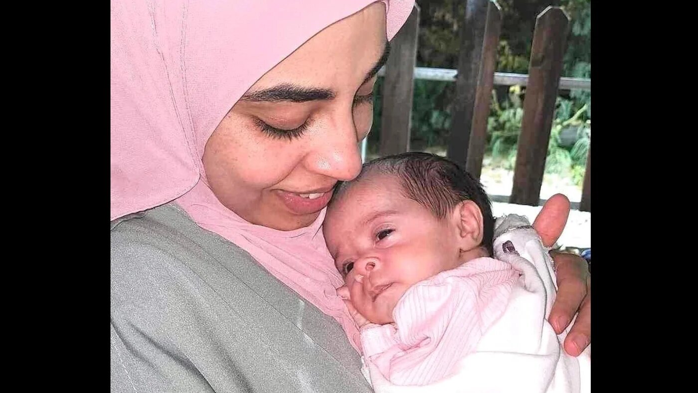 Palestinian journalist Rula Hassanein, 29, who was detained by Israeli forces on 19 March, with her baby daughter Elia (Supplied)