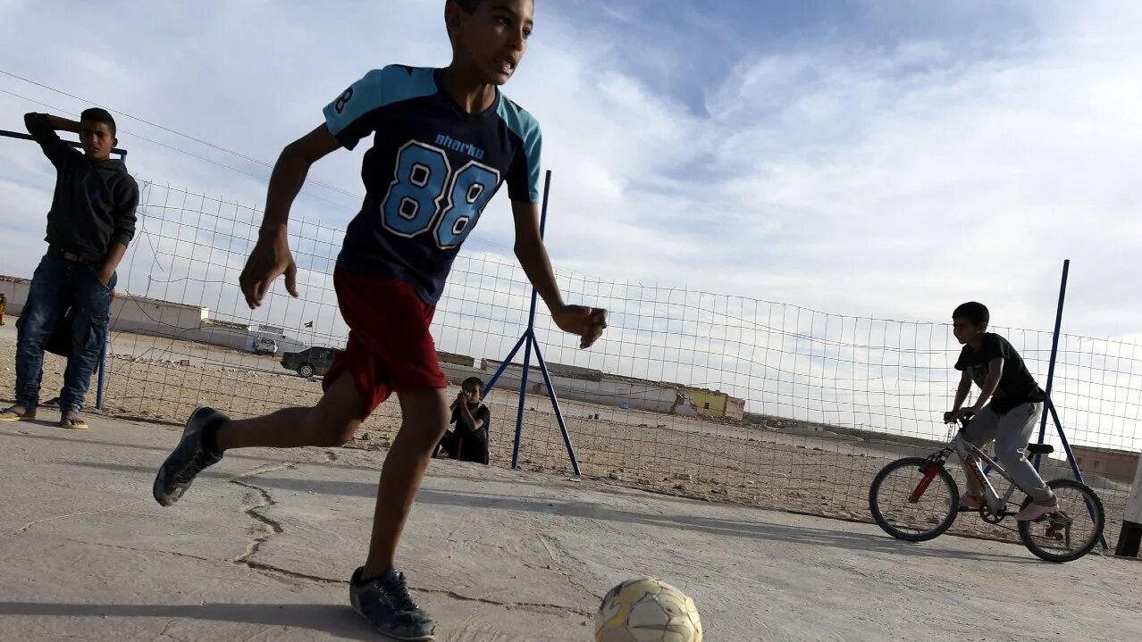 Sahrawi children play football in the Smara refugee camp in Algeria's Tindouf province in February 2016 (Farouk Batiche/AFP)