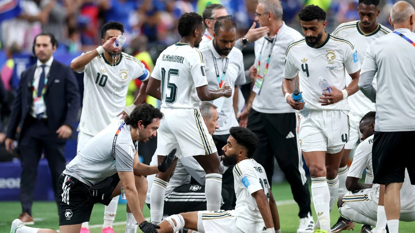 Saudi Arabia's players are pictured drinking water and getting medical treatment during a hydration break in their match against Cape Verde at Houston Stadium on 26 Jun 2026 (Michael Steele/Getty Images/AFP)