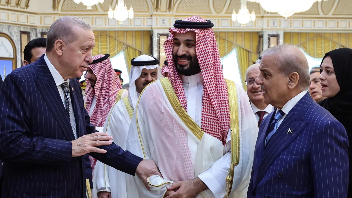 Turkey's President Recep Tayyip Erdogan (left), Saudi Arabia's Crown Prince Mohammed bin Salman (centre) and Pakistan’s Prime Minister Shehbaz Sharif (right) meet in Mecca, Saudi Arabia, on 7 August 2026 to sign a joint defence agreement (Handout/Turkish Presidency Press Office/AFP)