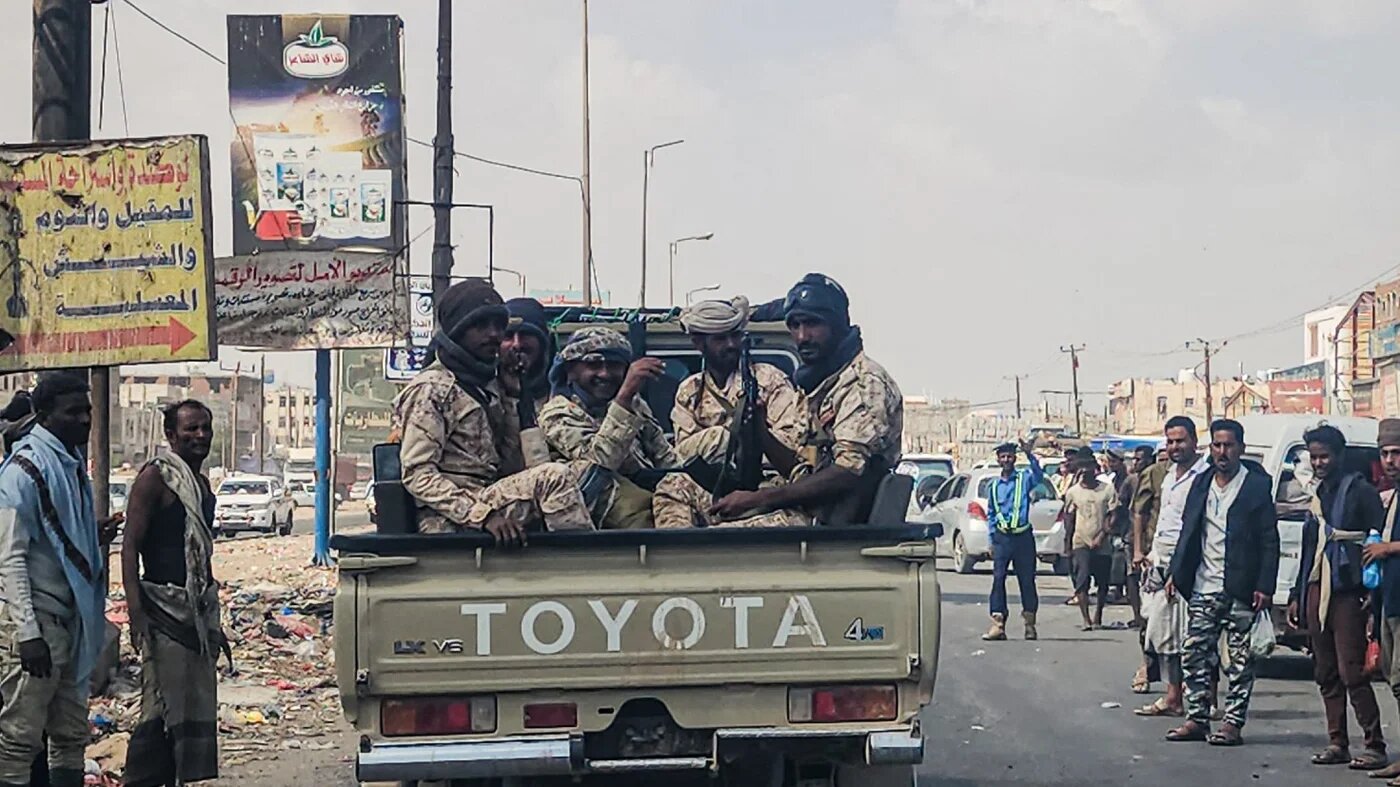 Fighters said to be backed by the Saudi-led coalition drive through the streets of the port city of Aden on 8 January 2026, the day after it was announced that Yemen's separatist leader had fled to the United Arab Emirates (AFP/file photo)