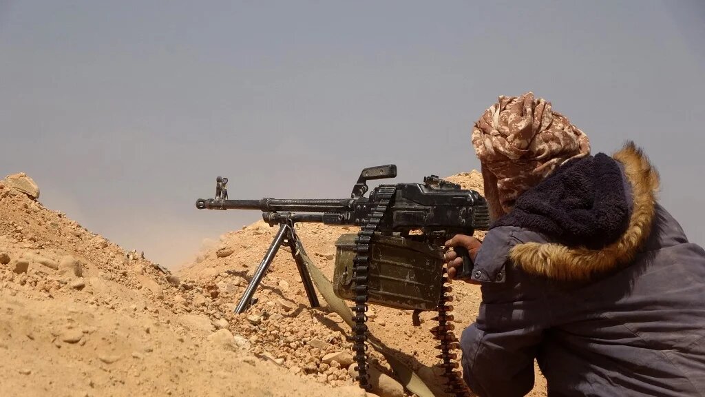 Forces loyal to Yemen's Saudi-backed government get into position during clashes with Houthi rebel fighters in Marib on 4 March 2021.
