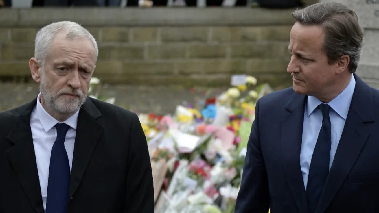 Then-British Prime Minister David Cameron and then-Labour Party leader Jeremy Corbyn in 2016 (Oli Scarff/AFP)