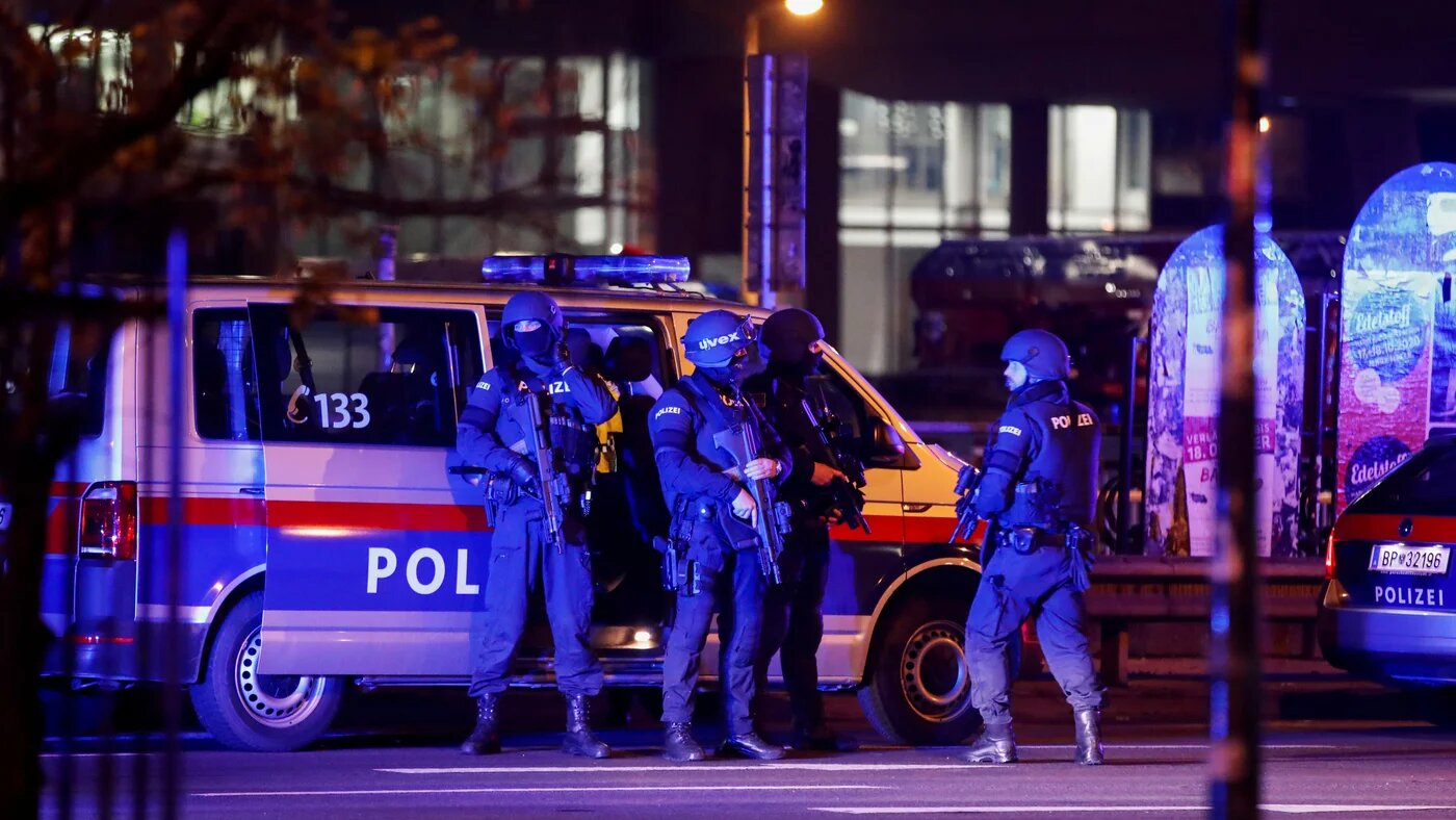Police officers stand guard on a street after exchanges of gunfire in Vienna, Austria on 3 November 2020.