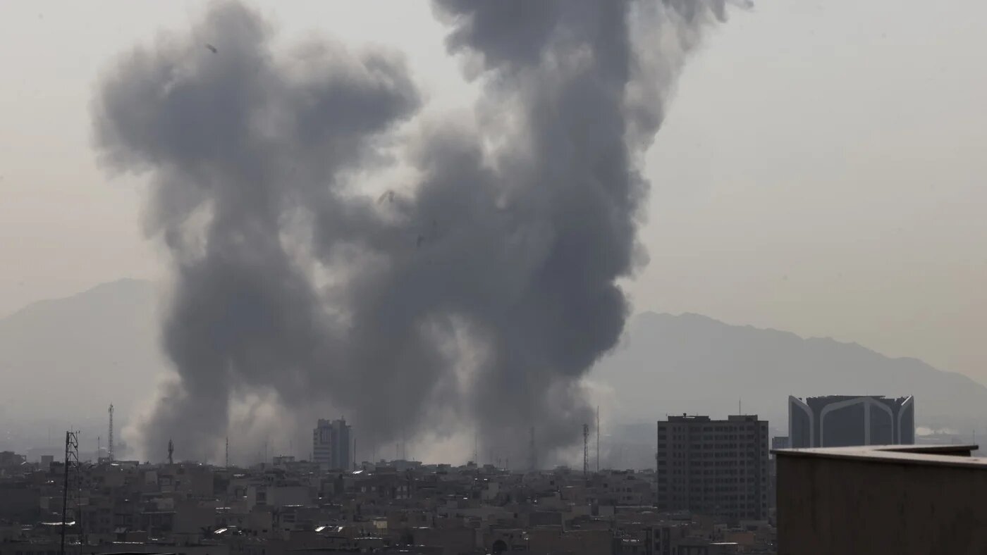 A plume of smoke rises following a reported explosion in Tehran on 28 February 2026 (AFP/Atta Kenare)