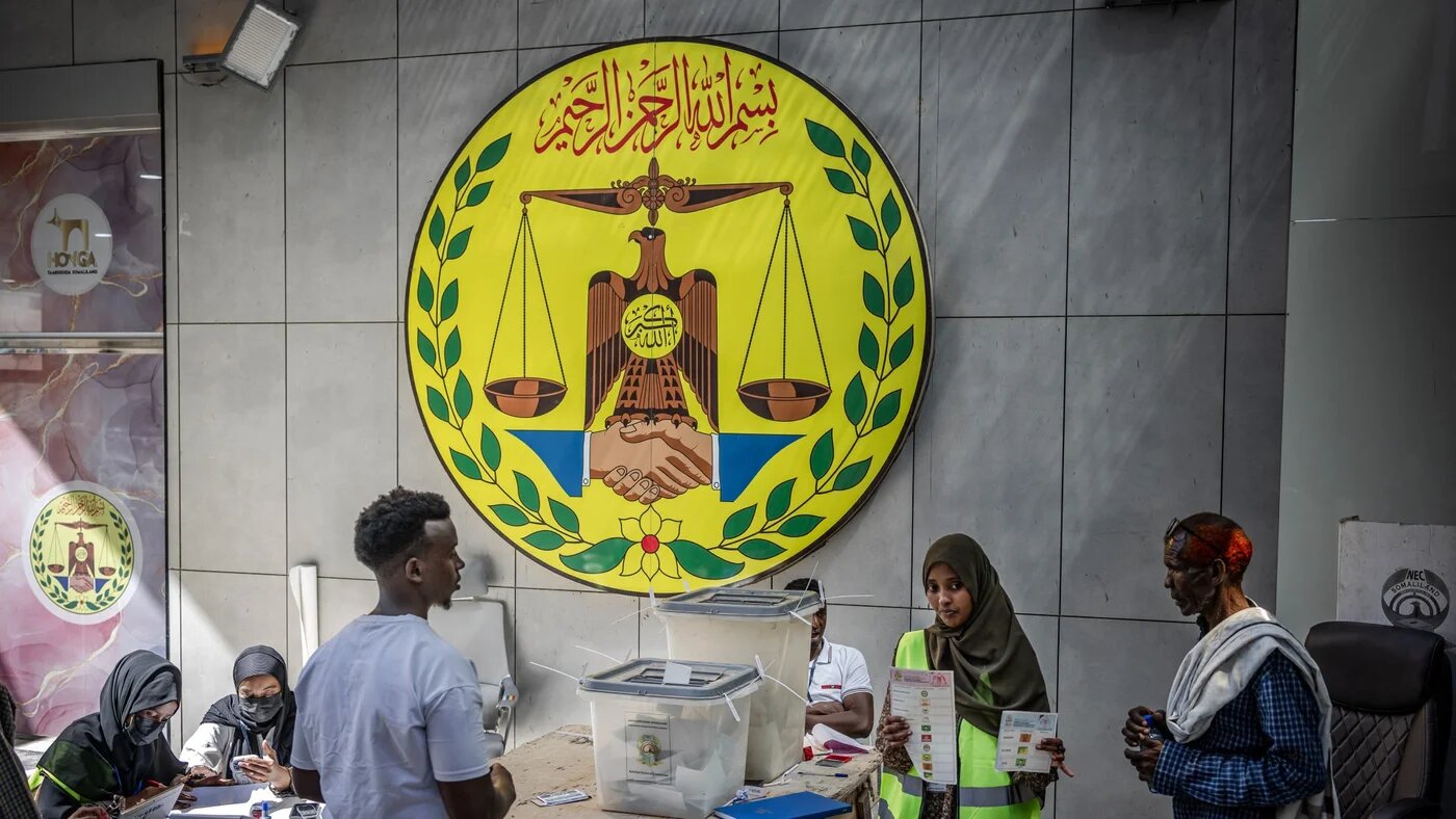 Somalliland National Electoral Commission (SNEC) officials monitor the voting process at a polling station during the 2024 Somaliland presidential election in Hargeisa on 13 November 2024 (AFP/Luis Tato)