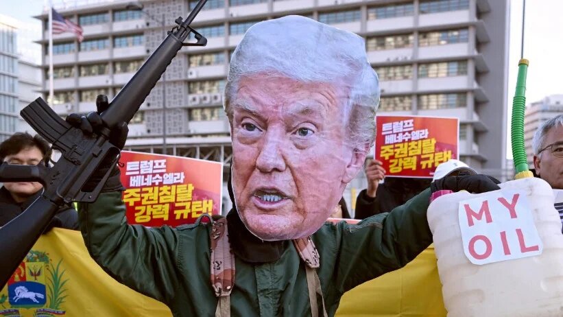 A protester wearing a mask of US President Donald Trump takes part in a demonstration condemning the Venezuela attack, in Seoul, South Korea, on 5 January 2026 (Jung Yeon-je/AFP)