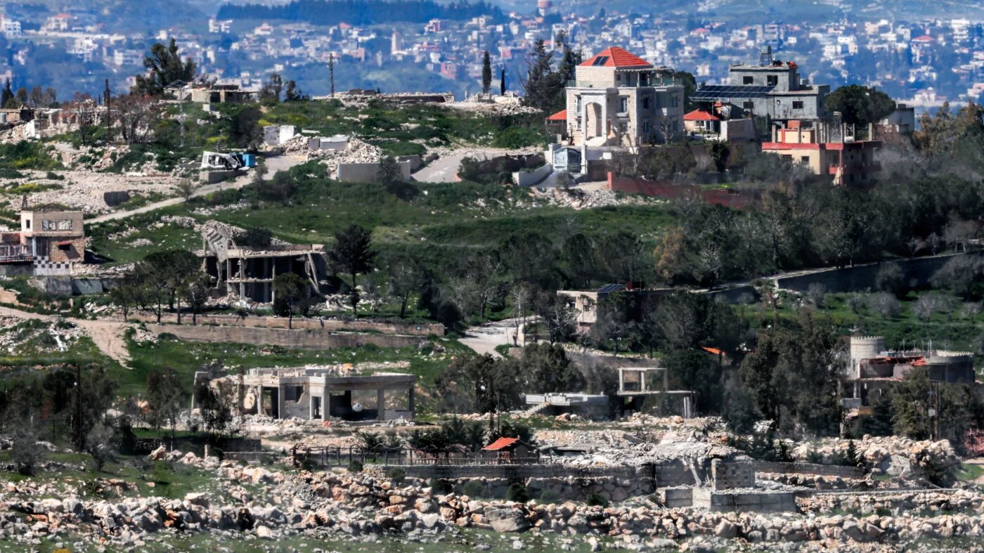 Destroyed buildings in the southern Lebanese town of Kfar Kila as seen northern Israel on 8 March 2026 (Jack Guez/AFP)