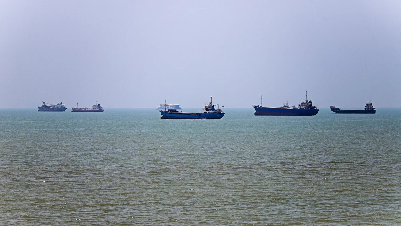 Vessels are seen anchored in Bandar Abbas along the Strait of Hormuz in a picture obtained on 18 June 2026 (AFP/Isna)