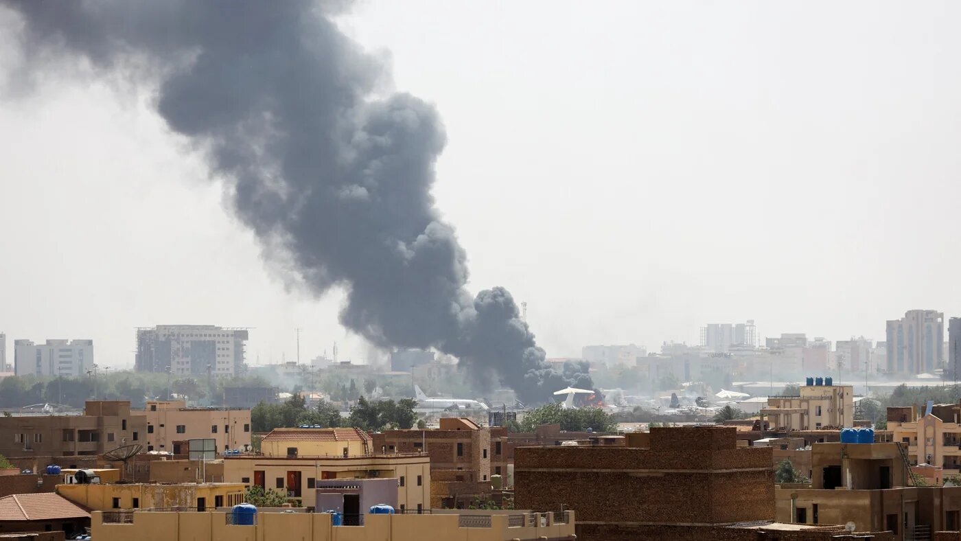 Smoke rises from burning aircraft inside Khartoum Airport during clashes between the paramilitary Rapid Support Forces and the army in Khartoum on 17 April, 2023 (Reuters)