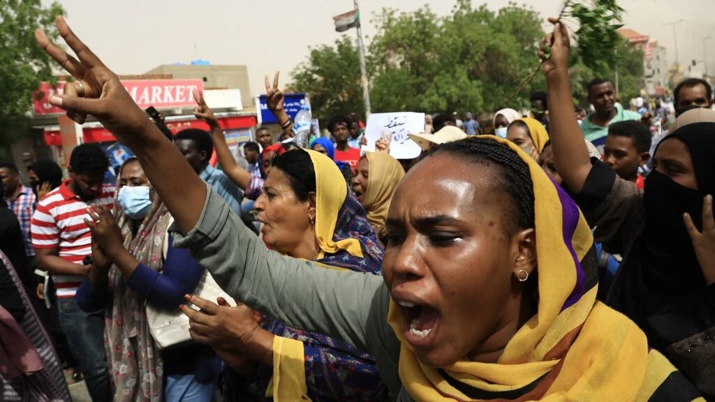 Sudanese march during a protest in the capital Khartoum urging the government to step down over recent harsh economic reforms on 30 June 2021.