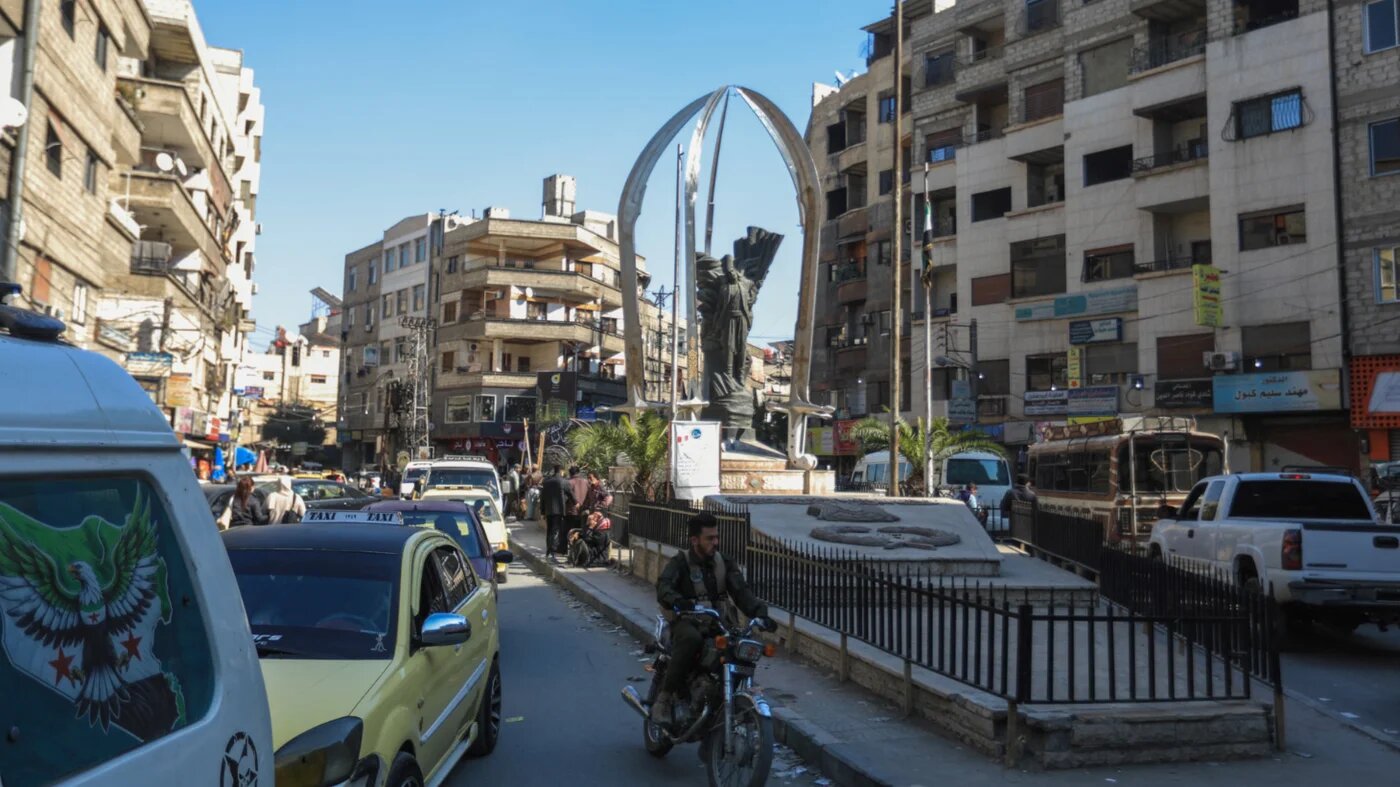 Vehicles drive through Jaramana on 2 March 2025 (Bakr Alkasem/AFP)