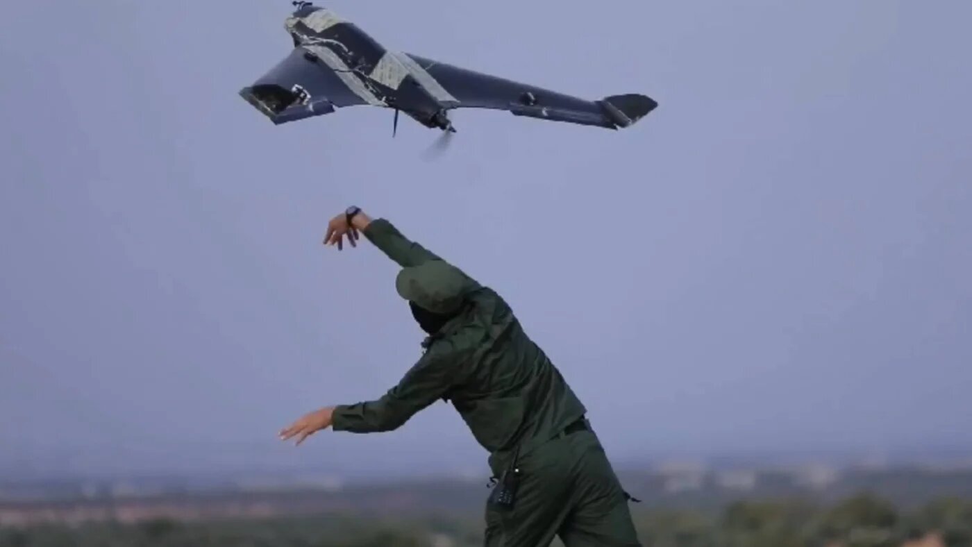 A screenshot from a video published by Hay'at Tahrir al-Sham shows a rebel fighter launching a Shaheen suicide drone (MEE)
