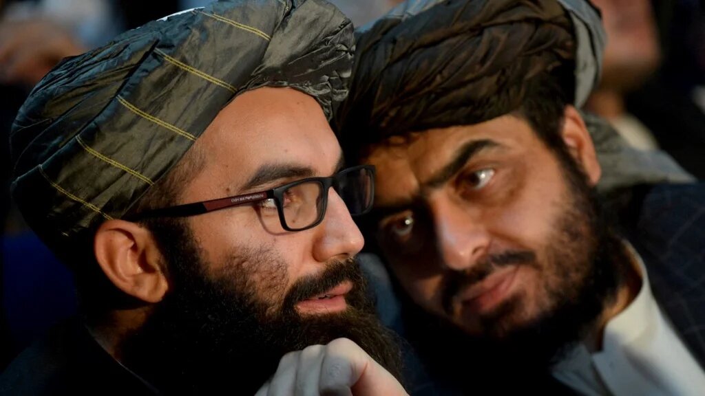 Taliban members attend a gathering to mark the first anniversary of their return to power in Kabul on 15 August 2022 (AFP)