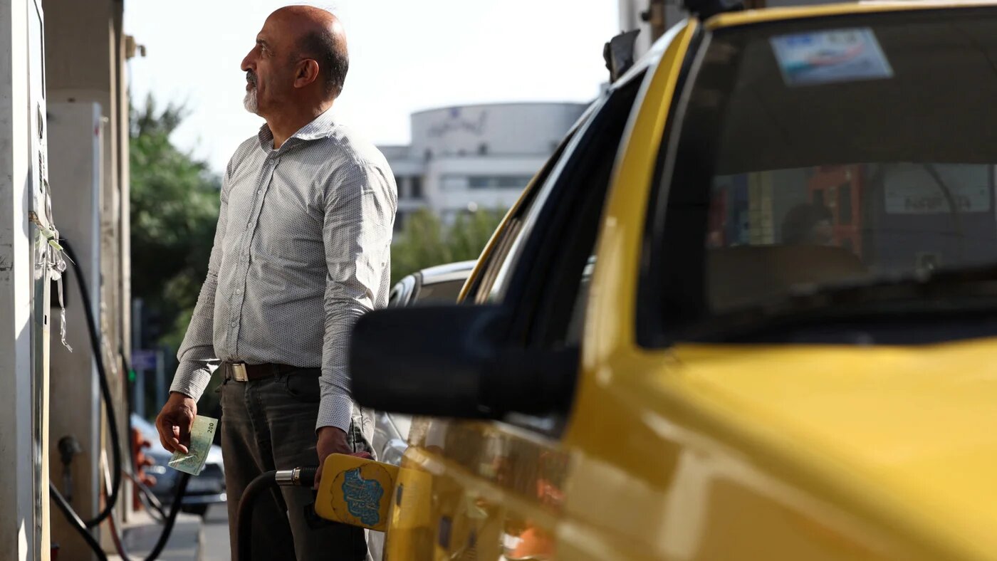 An Iranian man fills his car, on the verge of the rise in gasoline prices in Iran, at a gas station in Tehran, 7 September 2026 (Majid Asgaripour/WANA/Reuters)