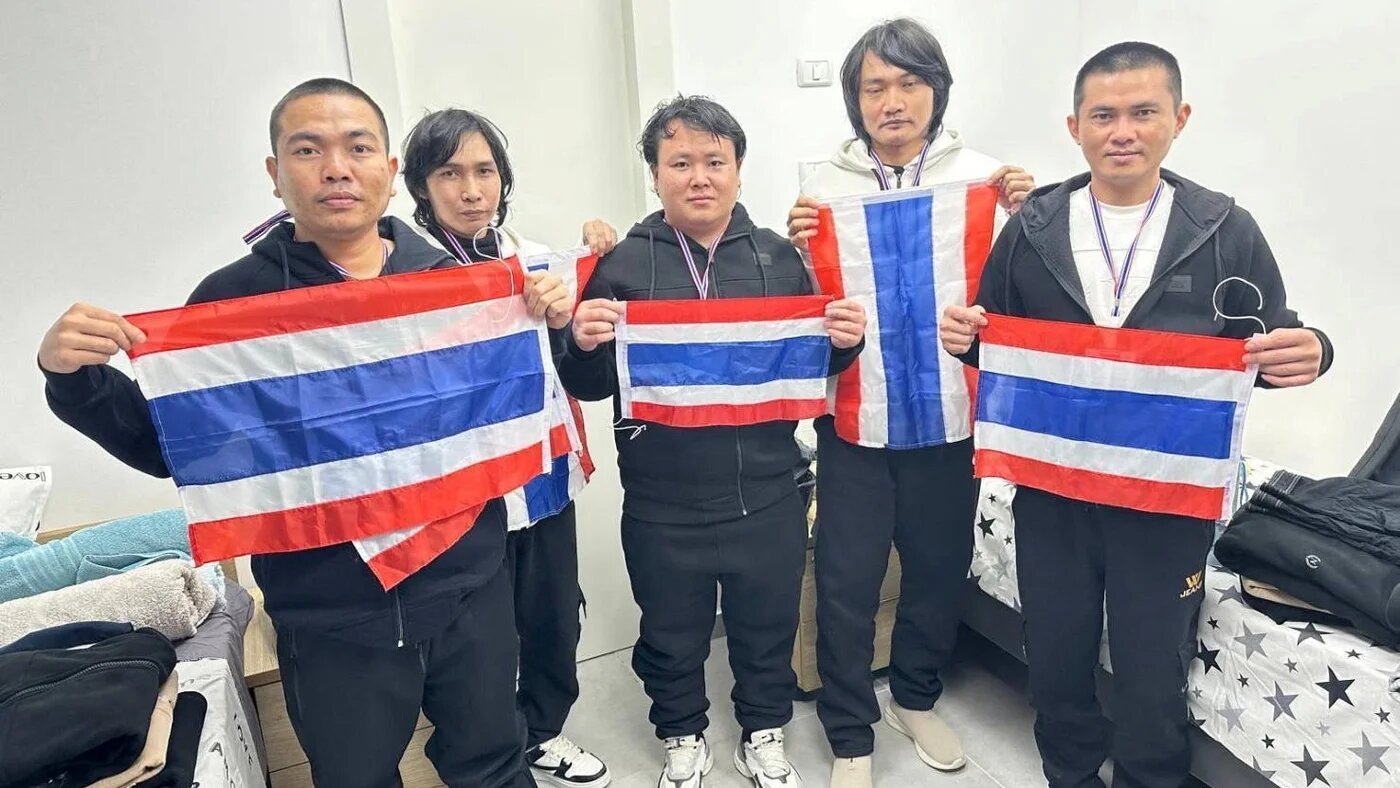Released Thai captives hold up Thai national flags in Israel on 30 January 2025 (Thai government/Thai embassy in Tel Aviv/Handout via Reuters)
