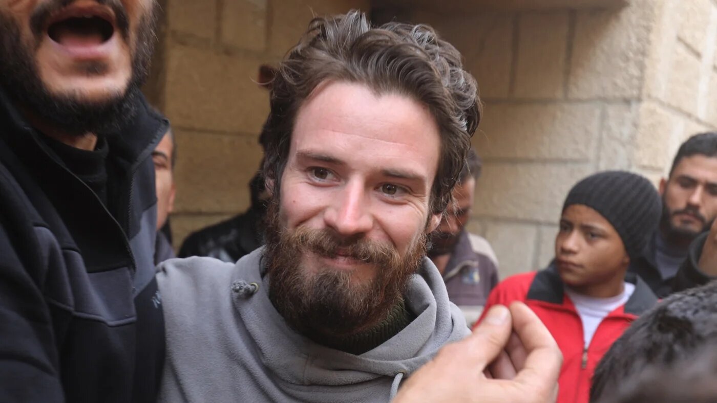 Travis Timmerman, a US citizen who had entered Syria from Lebanon on a Christian pilgrimage and had been detained for several months, speaks with reporters in a house in Damascus on 12 December 2024