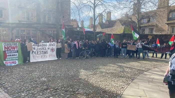 Protestors outside Trinity College in Cambridge, UK. (Varsity)