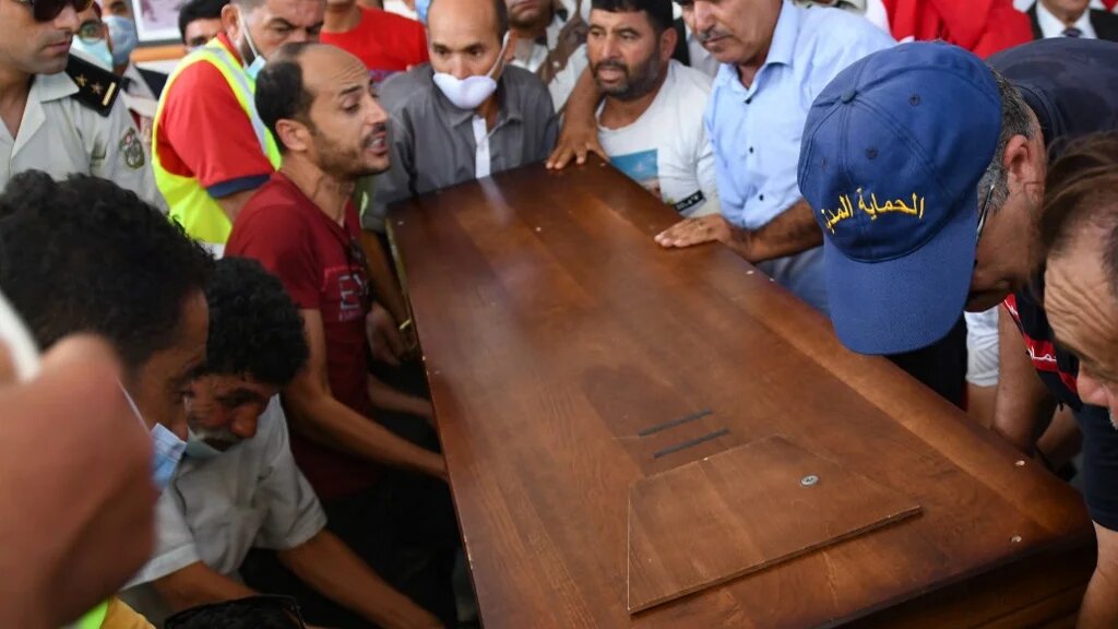 Members of the Tunisian National guard carry the coffin of a fellow officer after he was killed in an attack in the city of Sousse.