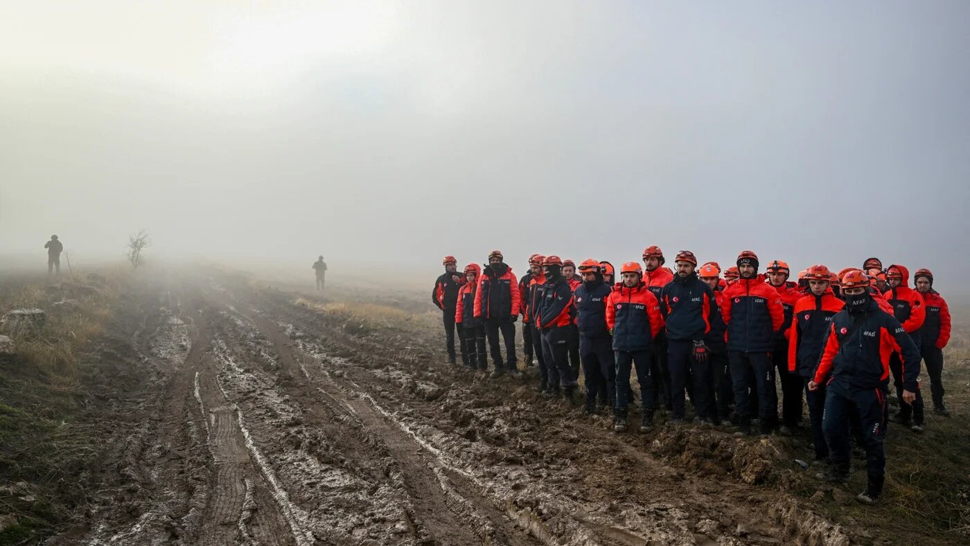 Turkish search and rescue team members arrive at the crash site of a jet carrying the Libyan army’s chief of staff, Mohammed Ali Ahmed al-Haddad, near Kesikkavak village in Turkey on 24 December 2025 (Reuters)