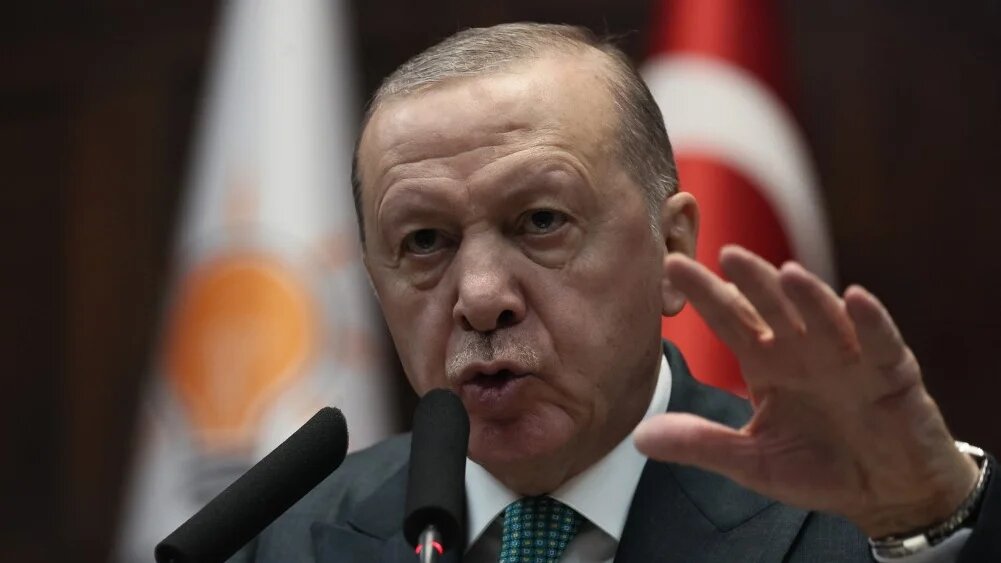 Turkish President and the leader of the Justice and Development Party (AKP) Recep Tayyip Erdogan gestures as he gives a speech during his party's parliamentary group meeting at the Turkish Grand National Assembly in Ankara on February 11, 2025 (AFP)