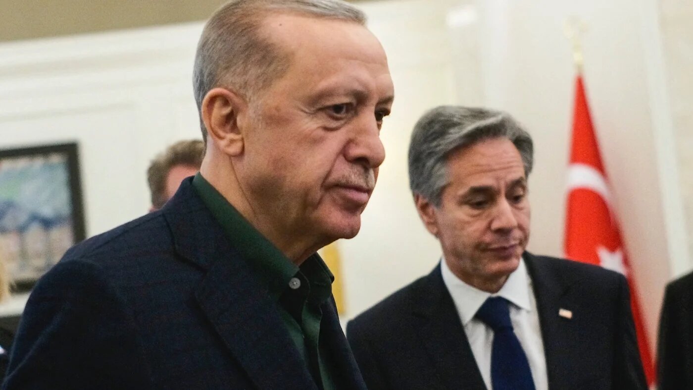 Turkish President Recep Tayyip Erdogan (L) talks to US Secretary of State Antony Blinken during their meeting at Esenboga airport in Ankara on February 20, 2023. (AFP)