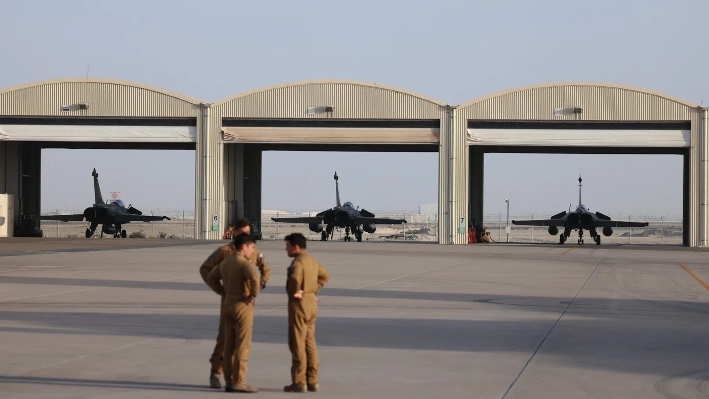 French pilots stand at the air base of Al Dhafra, near Abu Dhabi, which jointly shared between France, the US and the UAE, on 20 December 2025 (AFP/Ludovic Marin)