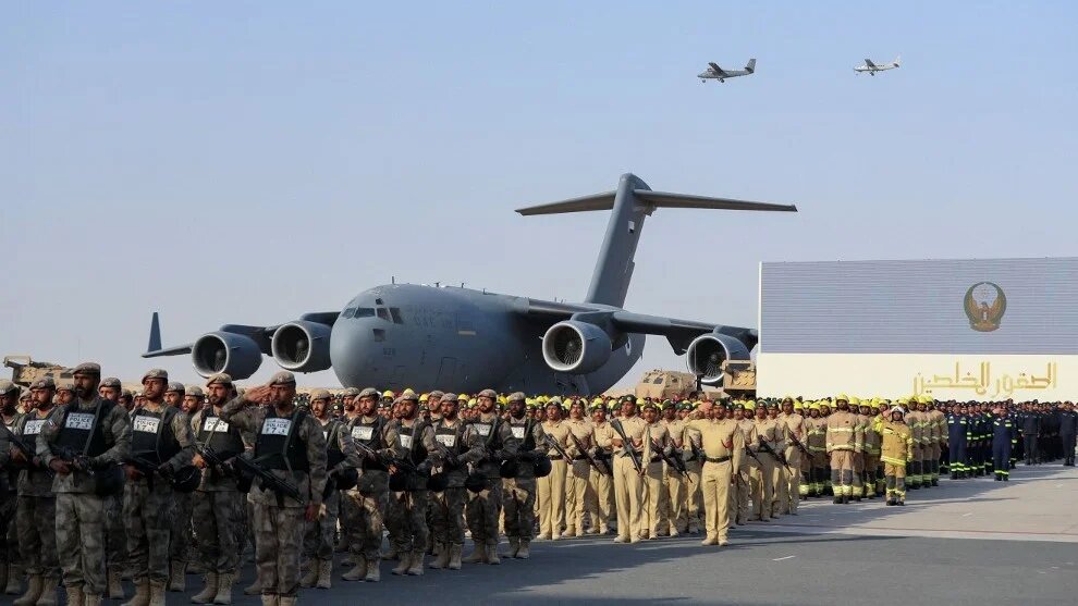 Emirati security forces form a guard of honour for members of the armed forces who fought in Yemen at Zayed Military City, Abu Dhabi, in February 2020 (AFP)