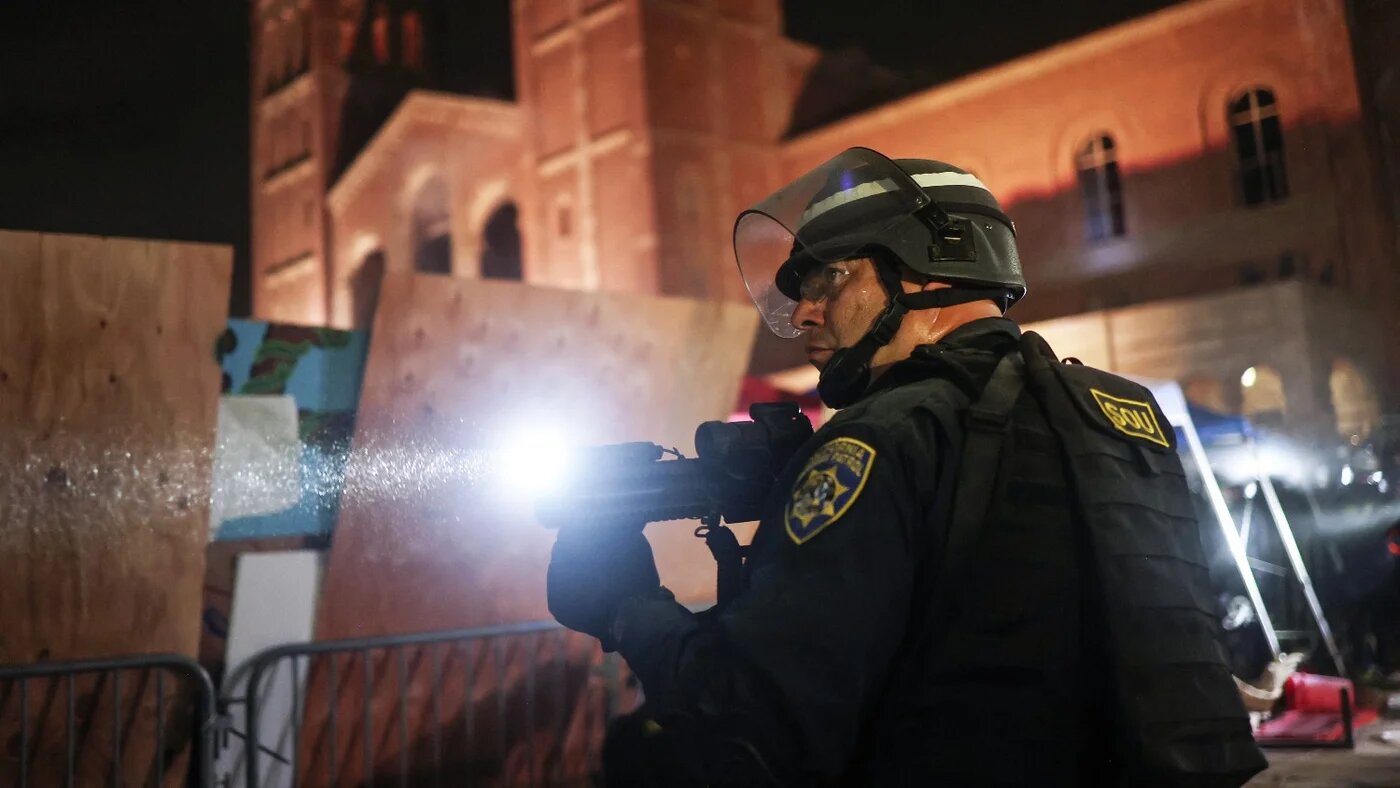 California Highway Patrol officers clear a pro-Palestinian encampment at the University of California, Los Angeles campus on 2 May 2024.