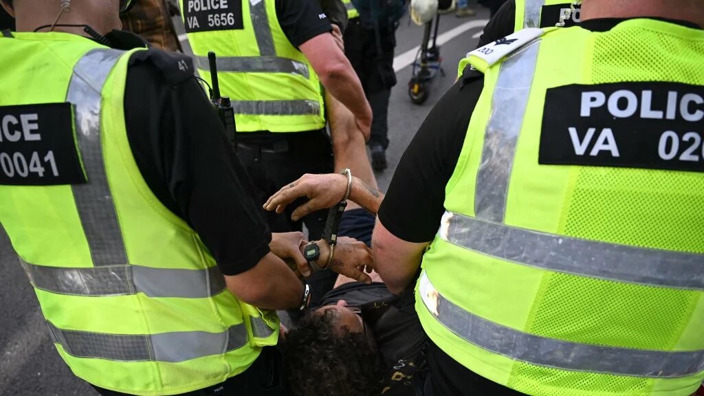 A protester is carried away by police officers at a demonstration in support of Palestine Action in central London on 6 September 2025 (Justin Tallis/AFP)