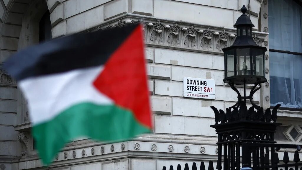 Pro-Palestinian supporters march past Downing Street, in central London, at a demonstration marking the anniversary of the Nakba, in May 2024 (Benjamin Cremel/AFP)