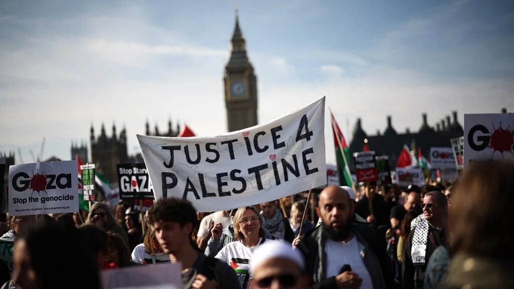 Pro-Palestine supporters hold a demonstration in London on 11 October 2025 (Henry Nicholls/AFP)