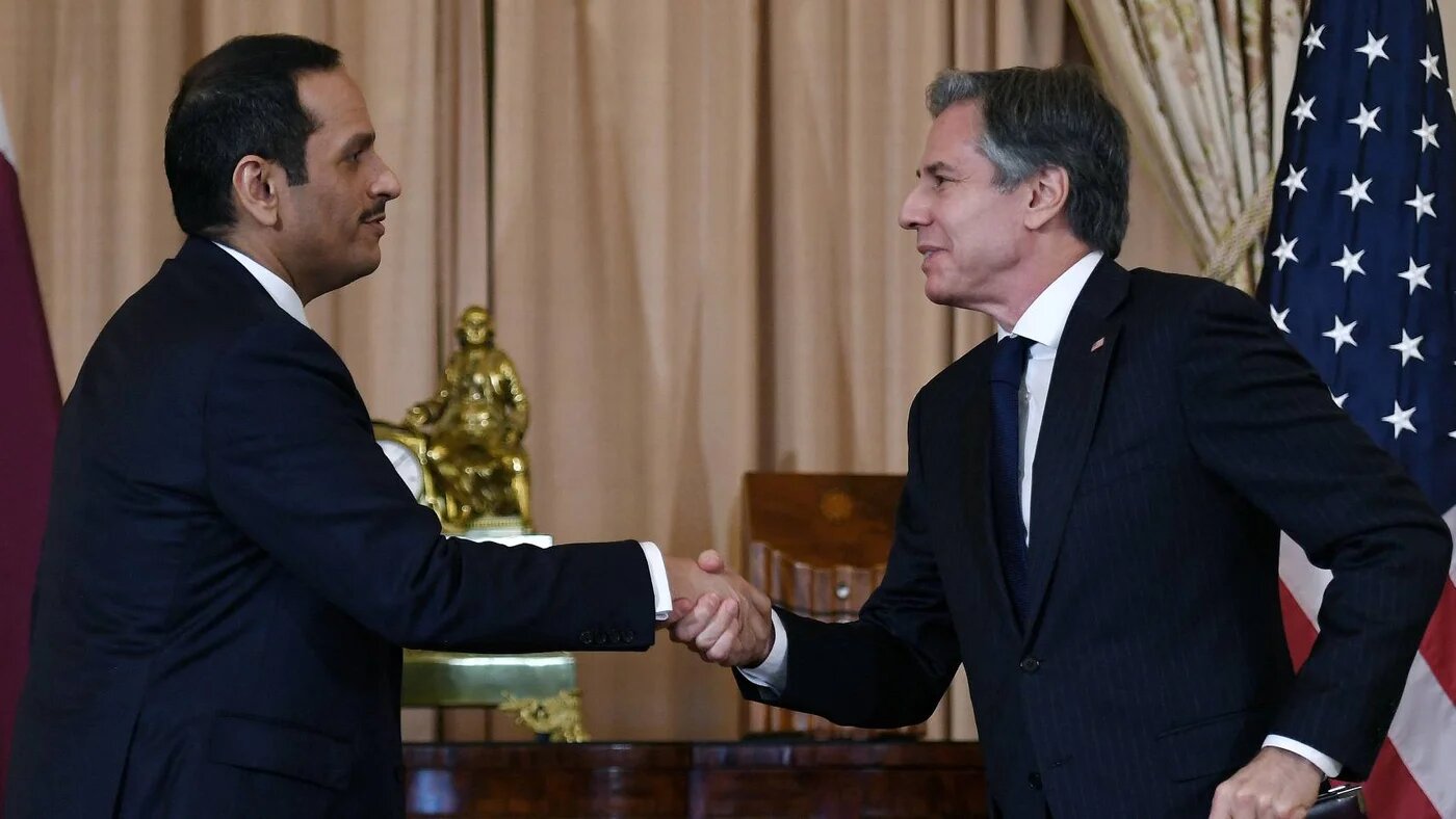 US Secretary of State Antony Blinken and Qatar's Foreign Minister Mohammed bin Abdulrahman Al Thani shake hands at the State Department in Washington on 12 November 2021.
