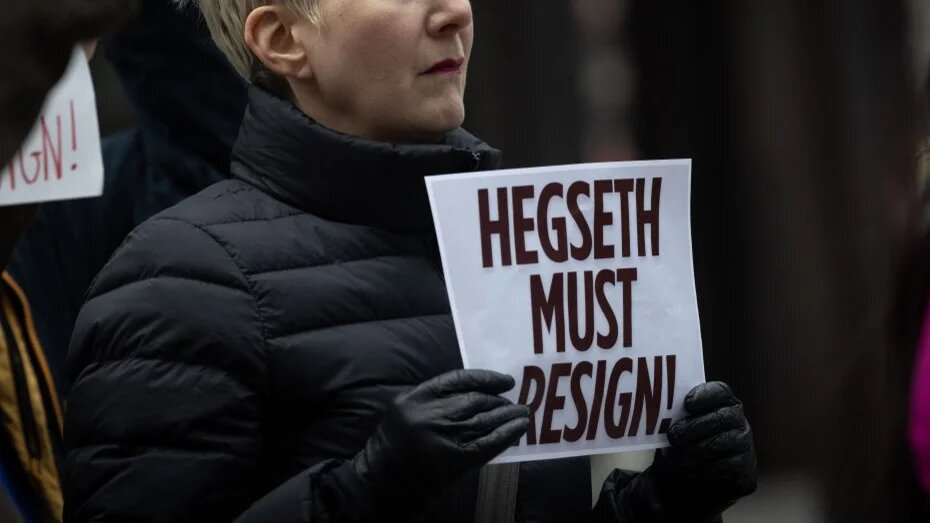 Protesters call for the resignation of US Defence Secretary Pete Hegseth on 27 March 2025 in Chicago, Illinois, in the wake of the Signal scandal (Scott Olson/Getty Images/AFP)