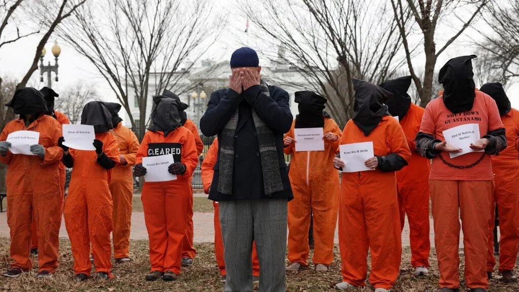 Activists representing the men still held at the US detention facility in Guantanamo Bay, Cuba, protest outside the White House on 11 January 2023 (Alex Wong/Getty Images/AFP)